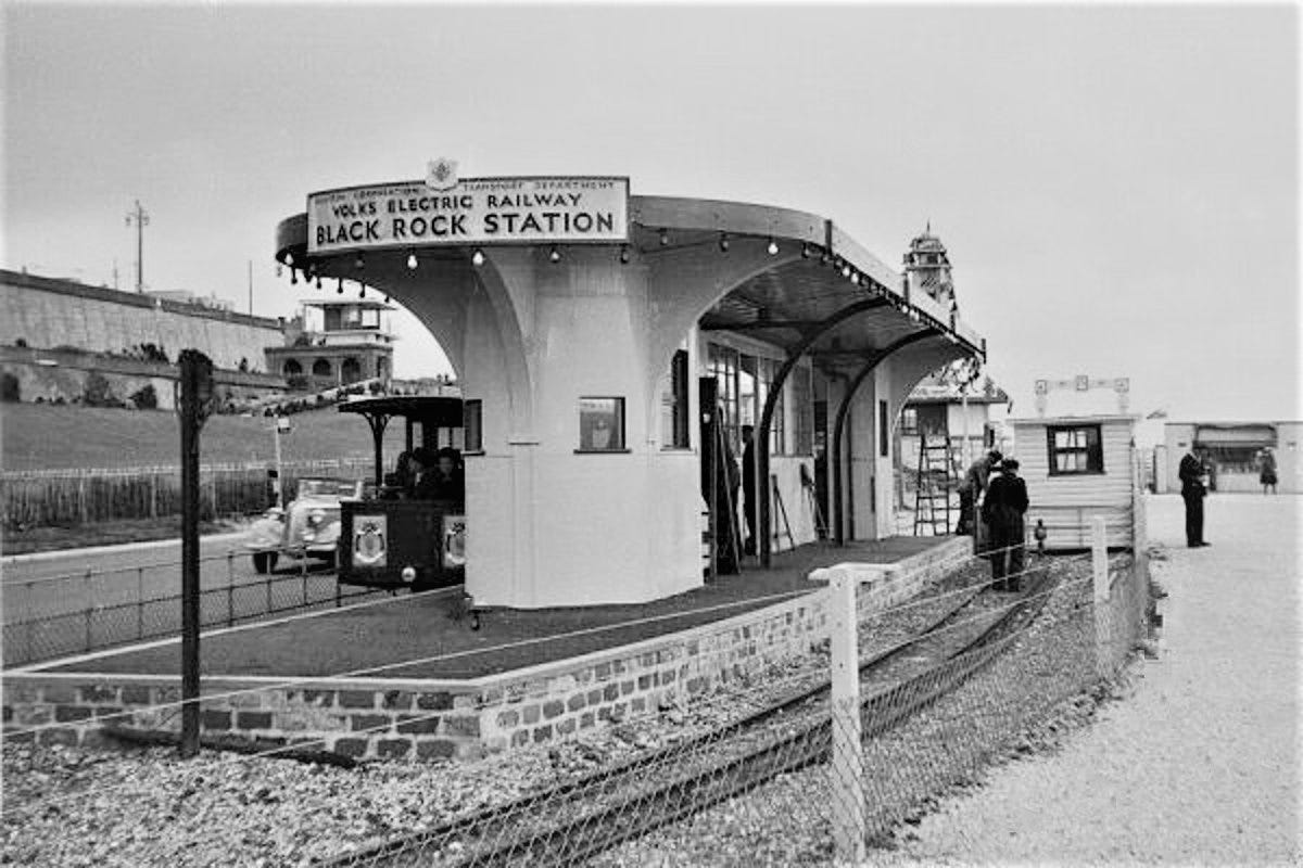 May be an image of 3 people and railroad