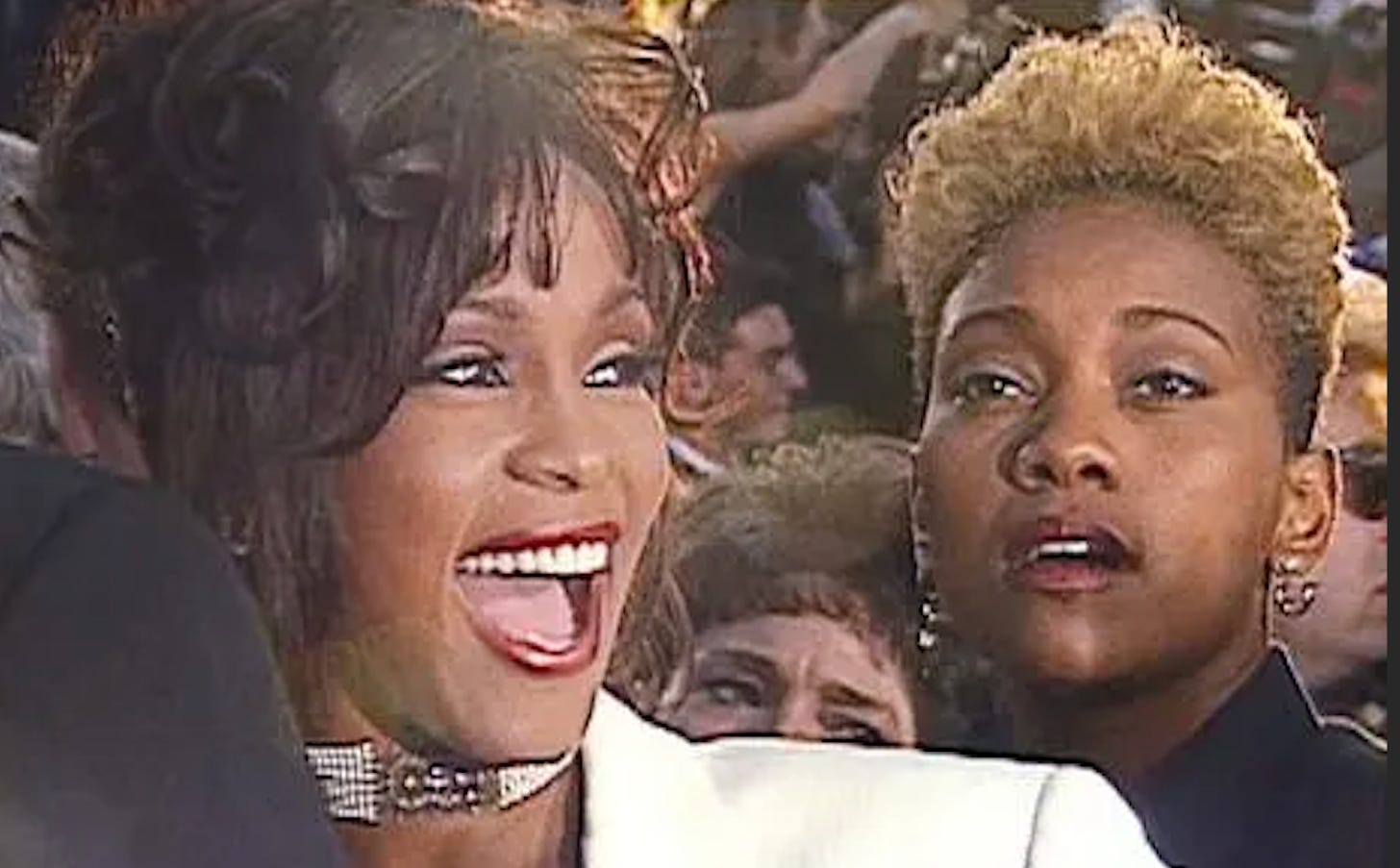 Whitney Houston and Robyn Crawford on the red carpet of an awards show