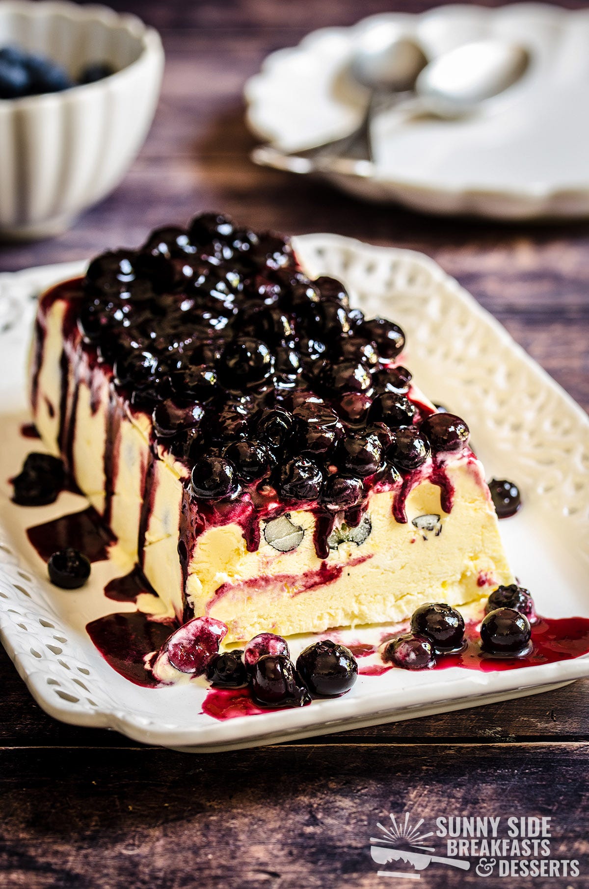 Lemon blueberry semifreddo on a white serving platter.