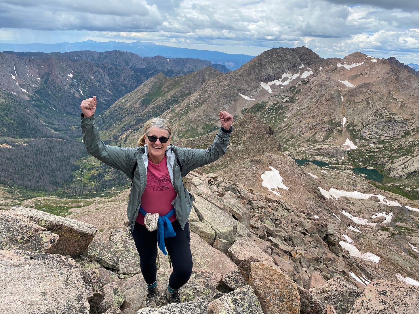 Stacy upon summit of Windhom Peak