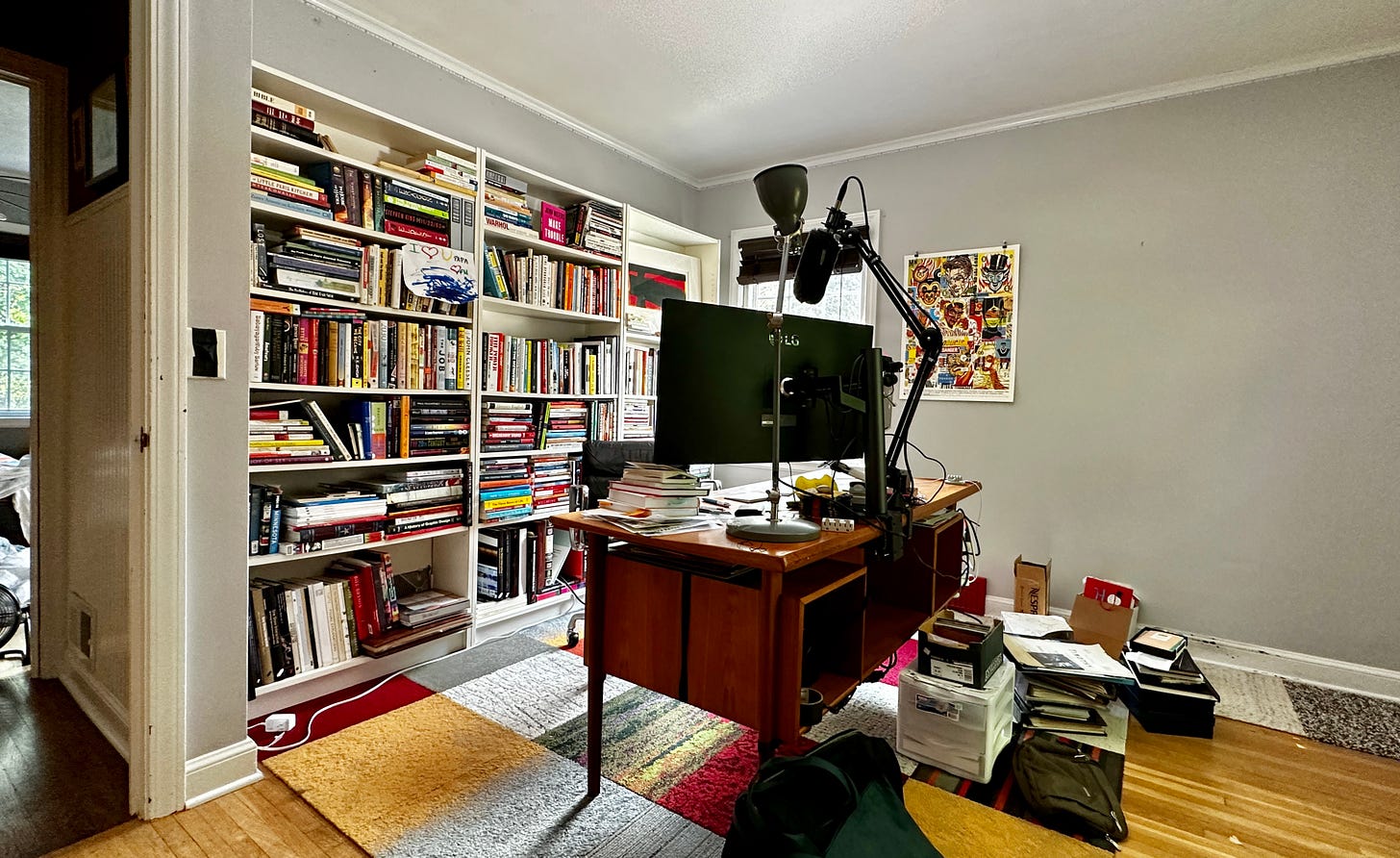 Home office with bookshelves and a desk