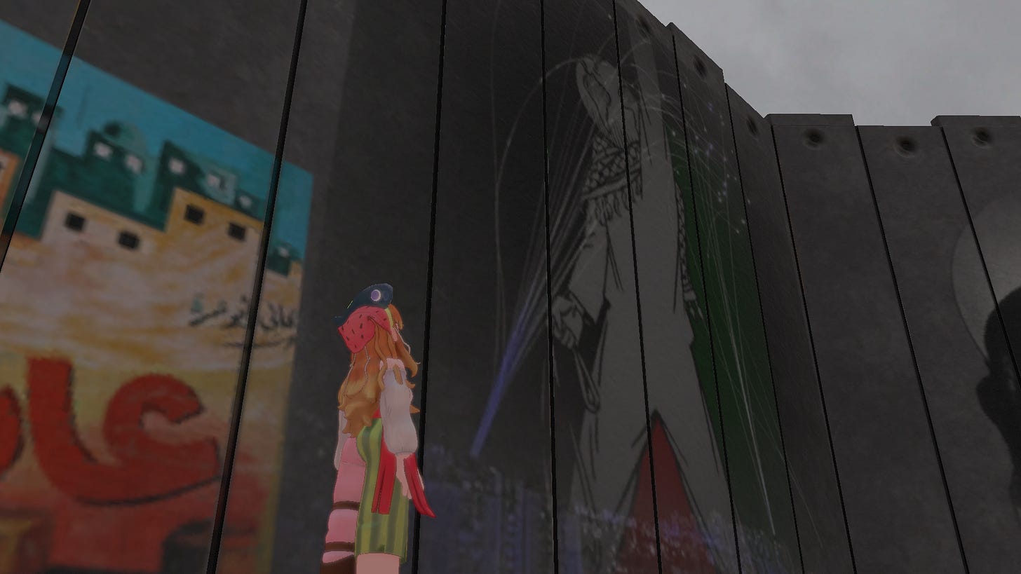 Bonito stands in front of a mural, looking up at it. The mural is of a Palestinian activist, with the Palestine flag behind them.