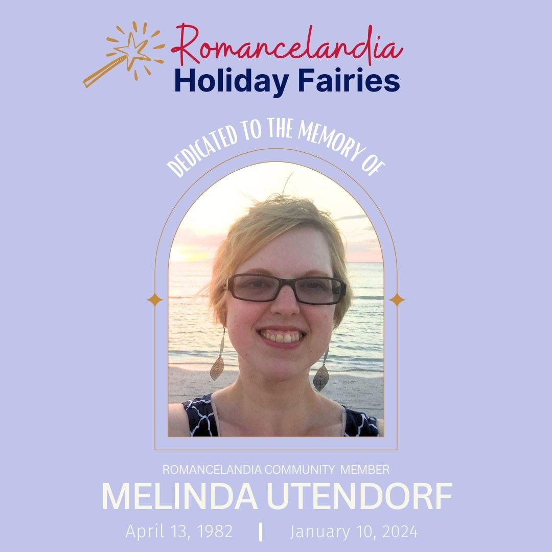 Romancelandia Holiday Fairies: Dedicated to the Memory of Romancelandia Community Member Melinda Utendorf. April 13, 1982-January 10, 2024. Image of smiling white woman with short blond hair and thick framed glasses standing in front of the ocean and a beautiful sunset.