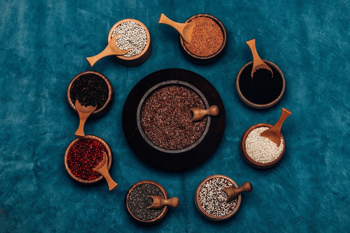 bowls of colorful grain on a blue background