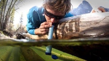 drinking through a filtering tube 