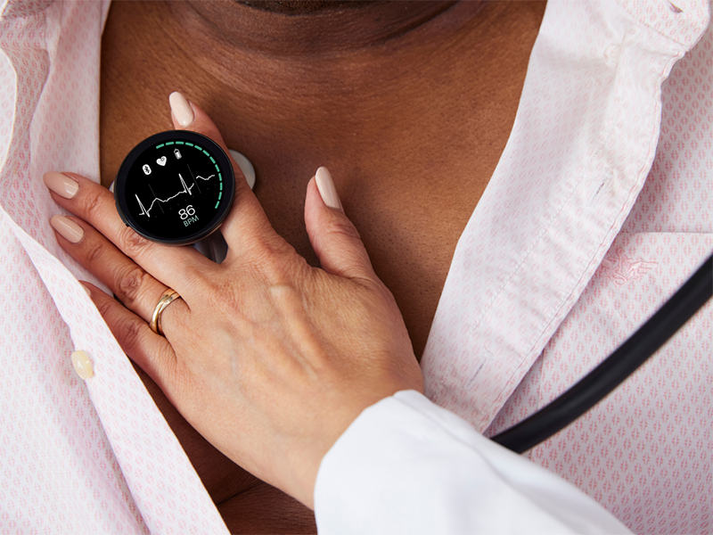 Clinician listens to patient's heart with CORE 500™ Digital Stethoscope