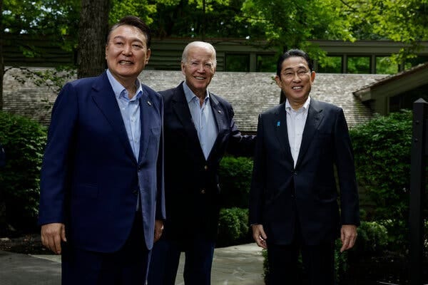 Yoon Suk Yeol, President Biden and Fumio Kishida pose for a picture at Camp David. Yoon Suk Yeol, President Biden and Fumio Kishida pose for a picture at Camp David.