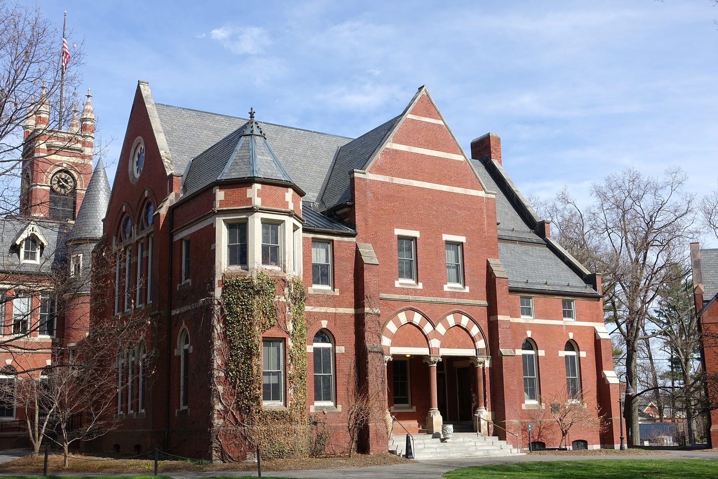 A brick building with ivy.