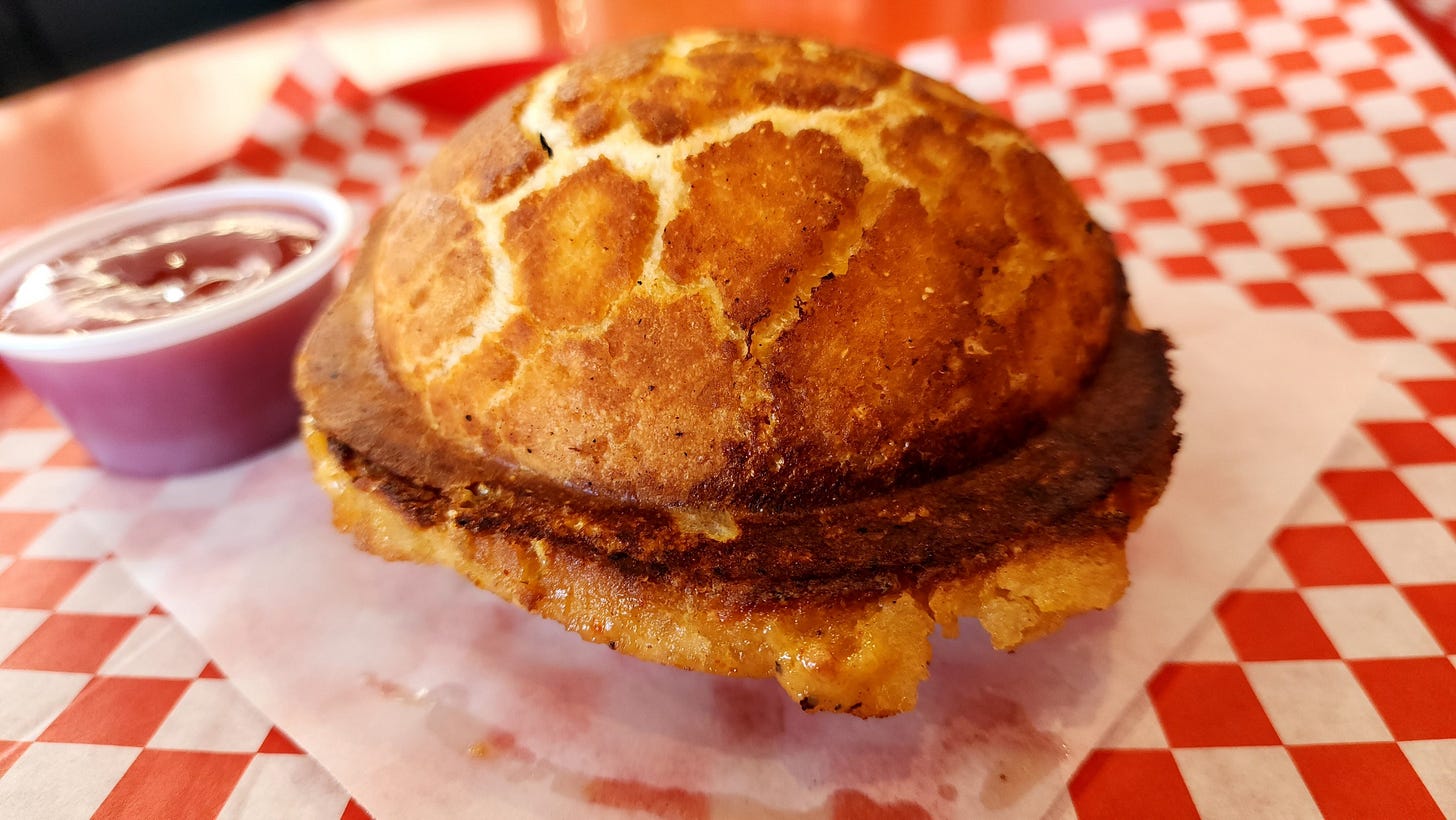 The Pocket Burger, a burger encased in is own bun, at The Mouth in Burbank