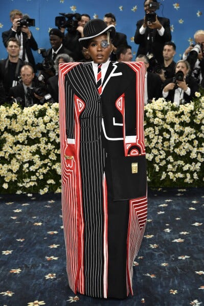 Janelle Monáe embraces dandyism at the Met Gala with help from an Oscar  winner and tequila diamond | AP News