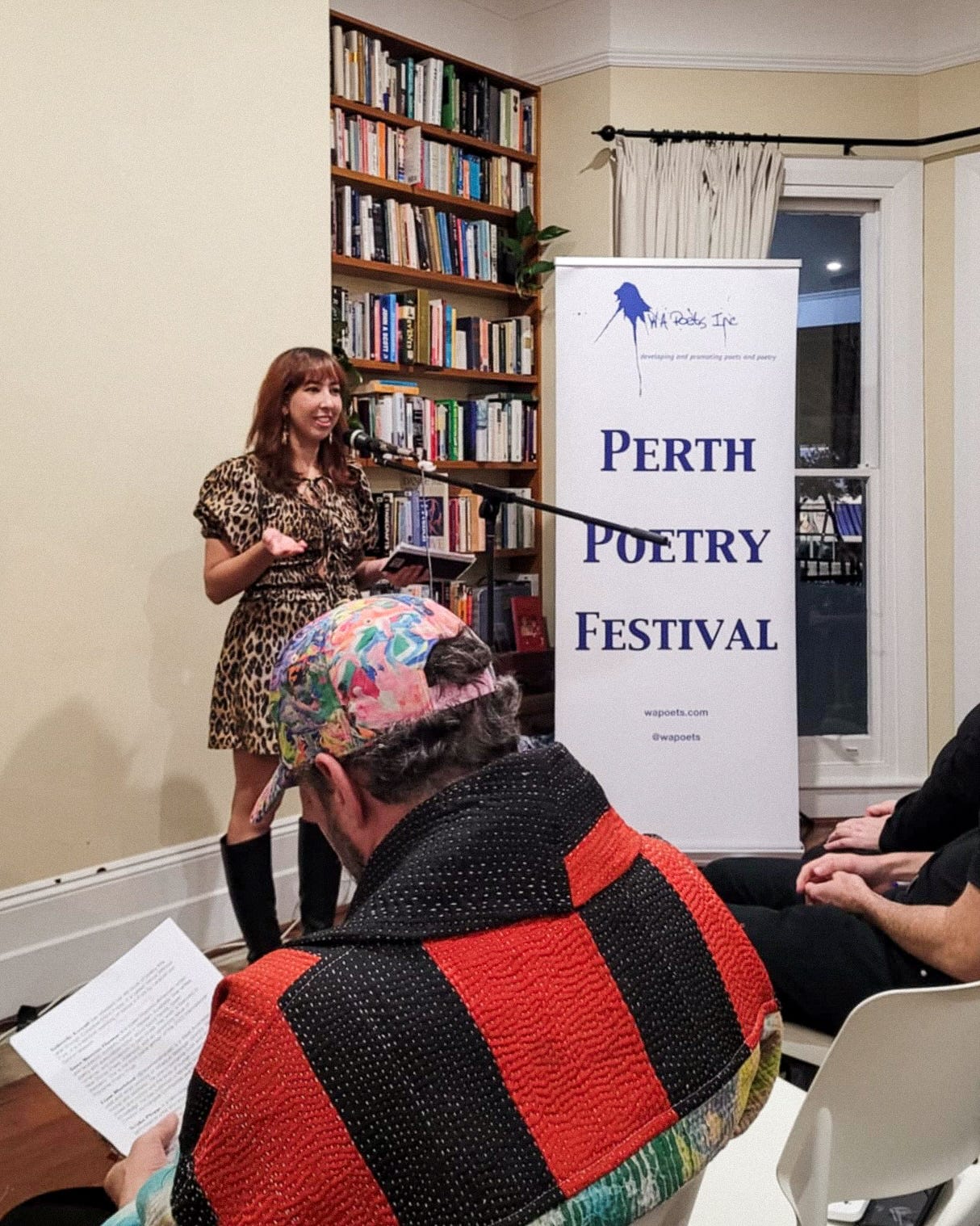 Caitlin reading to an audience at the OUTspoken poetry night for Perth Poetry Festival