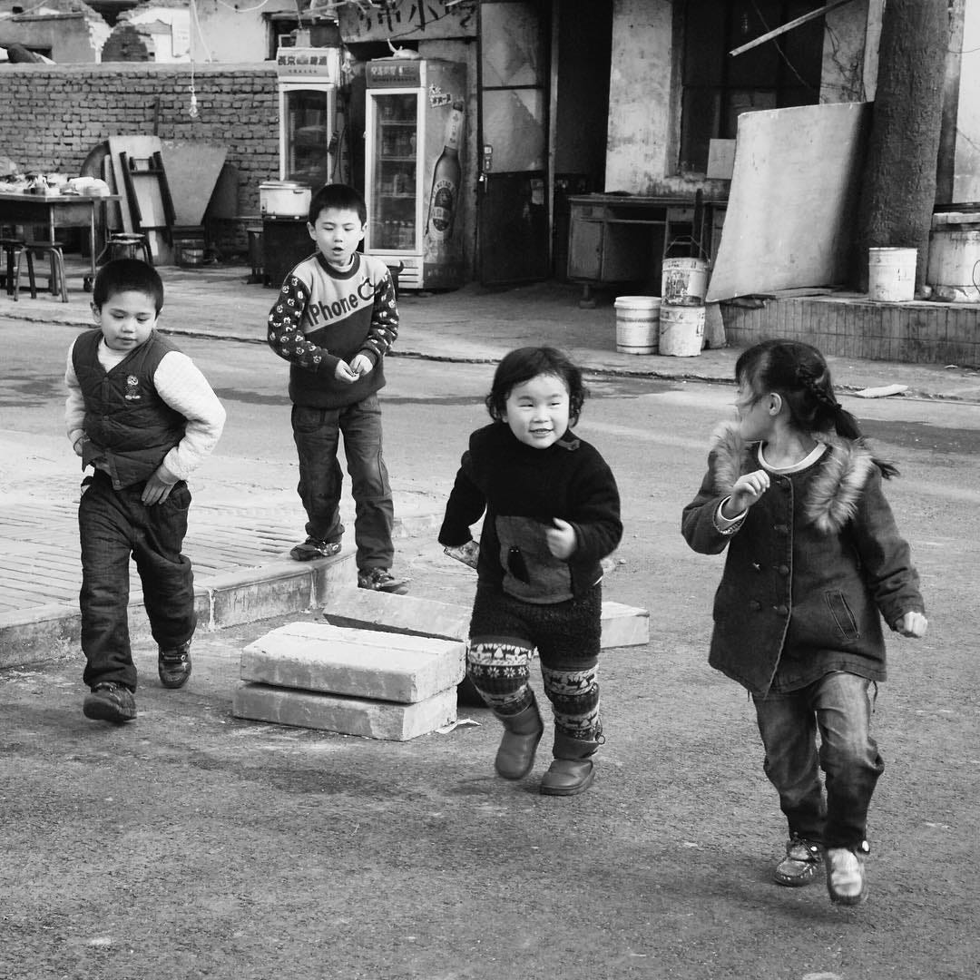 Kids playing in a hutong in Beijing.