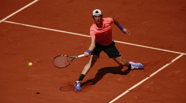 thanasi kikkinakis loses to novak djokovic french open 2015