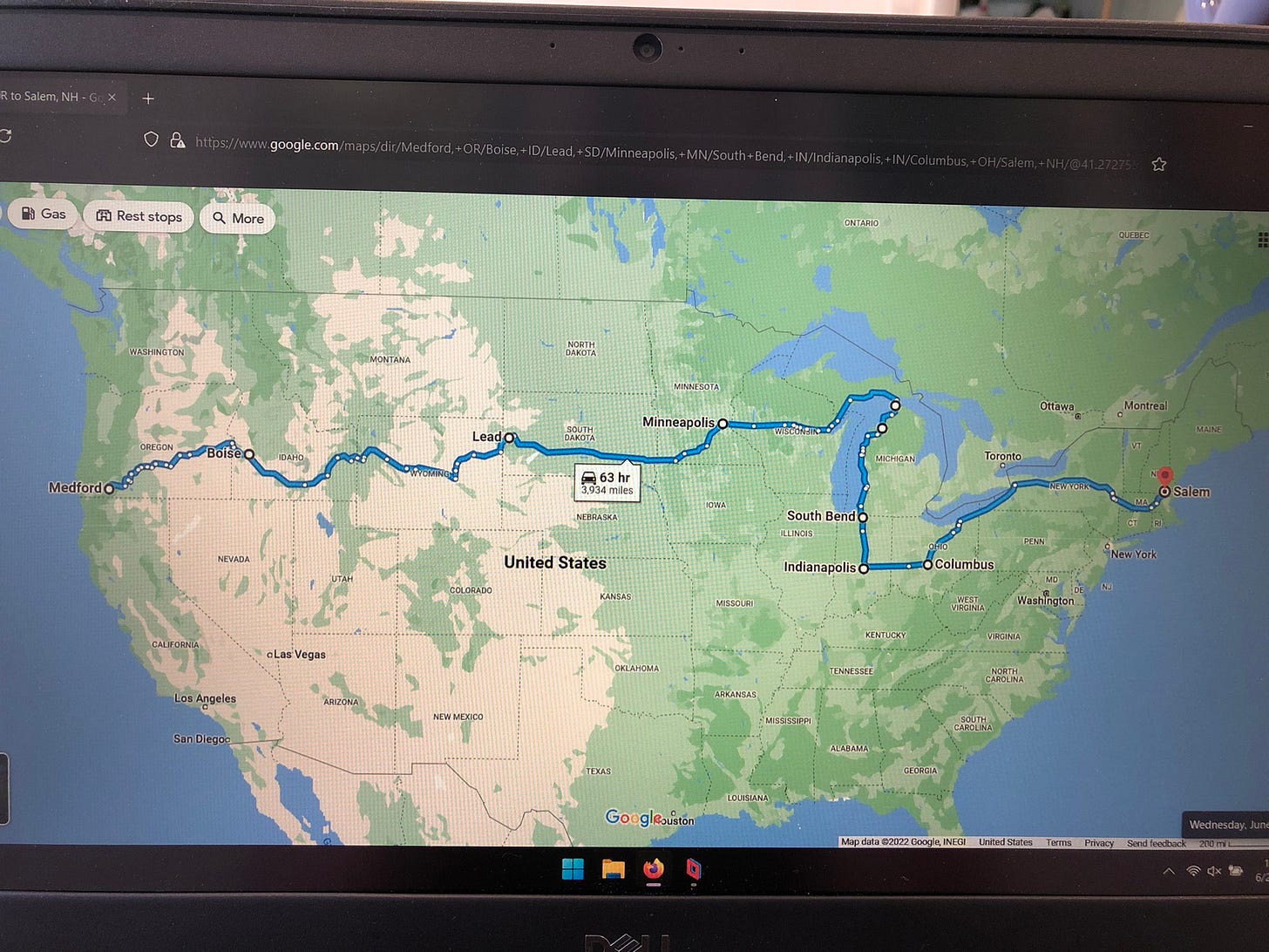 a laptop screen displaying a google map route from medford, oregon to salem, new hampshire that is 3934 miles, or 63 hours, long