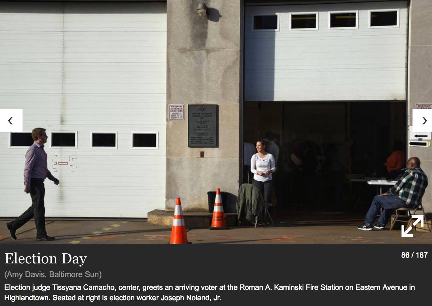 Screenshot of an Election Day photo from the “Baltimore Sun” featuring Tissyana Camacho serving as an election judge outside a fire station.