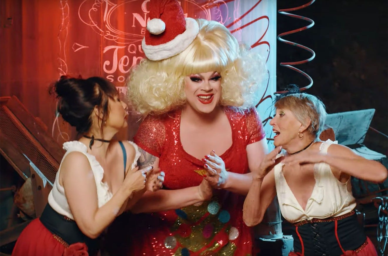 Longtime drag performer Nina West (center) is a host of "A Drag Queen Christmas."