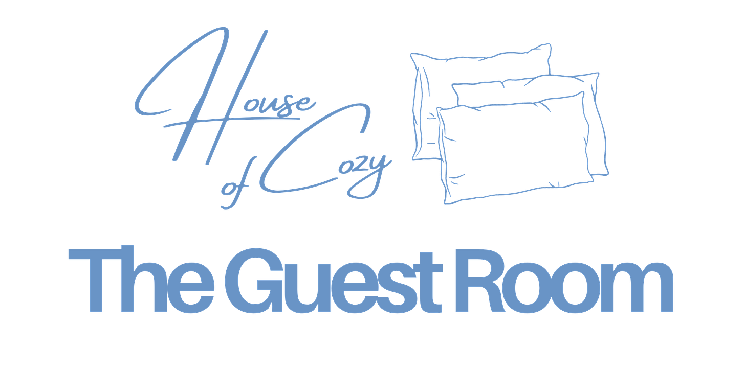 A dark-themed image showcasing the elegant blue script text "House of Cozy" accompanied by a line-drawn illustration of pillows. Below, in bold blue lettering, the words "The Guest Room" are prominently displayed.