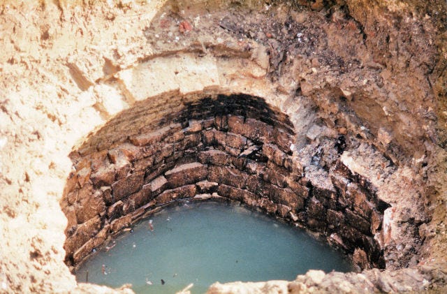 The well head is revealed during the 1990's building work to replace the well cap