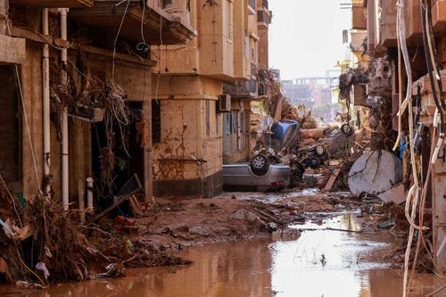 PHOTO: Overturned cars lay among other debris caused by flash floods in Derna, eastern Libya, on Sept. 11, 2023.