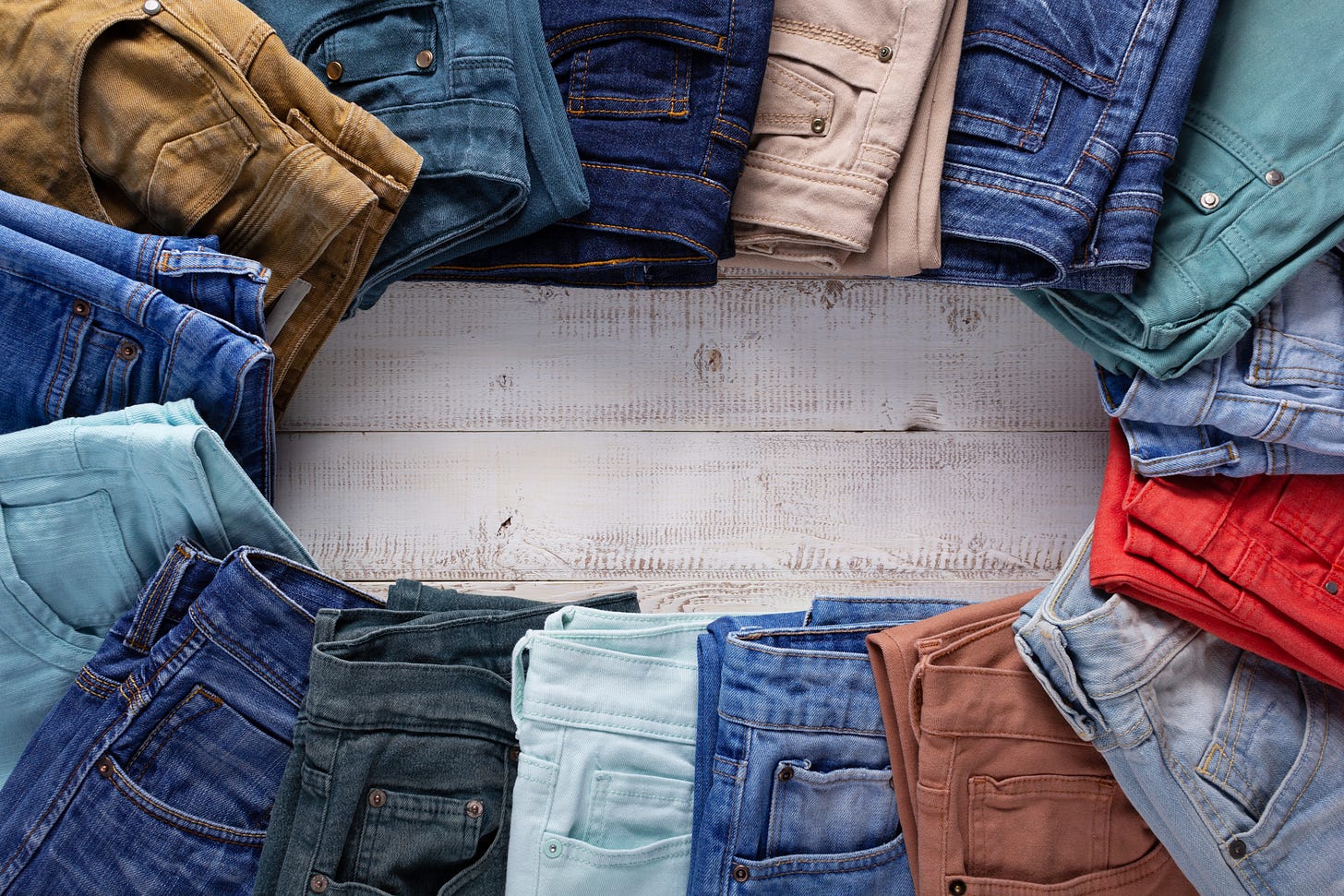 a bunch of different pairs of jeans