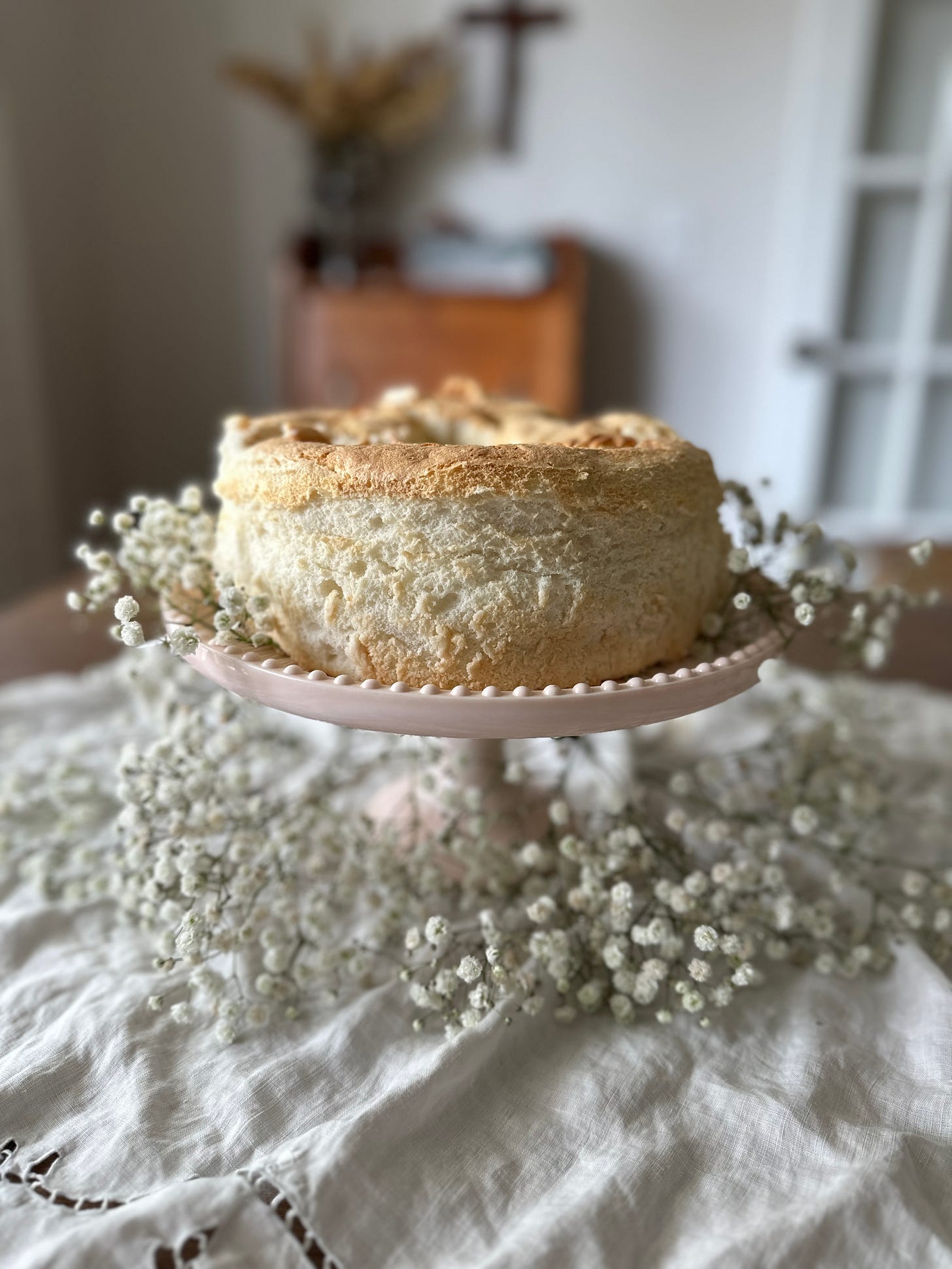 An Angel Food Cake on a Cake Stand