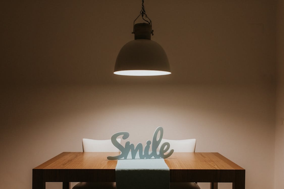 Free White Smile Cutout Signage on Table Stock Photo