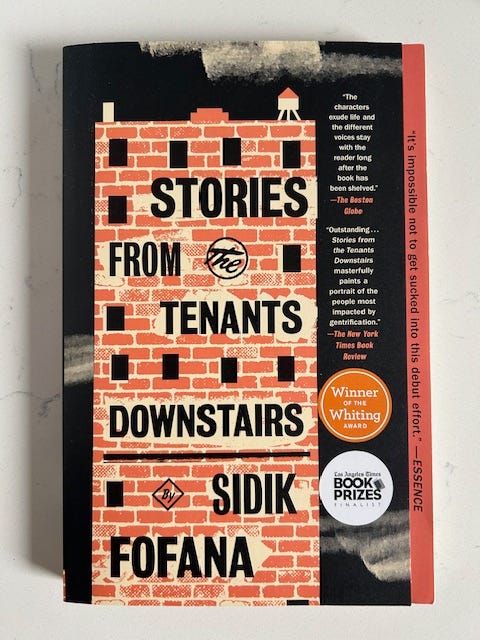 The cover of Stories From the Tenants Downstairs features a drawing of a brick apartment building.