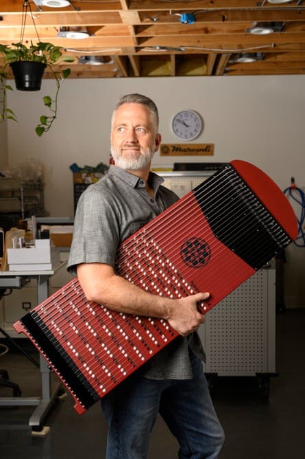 Tim Meeks, inventor of the Harpejji, pictured with his creation.
