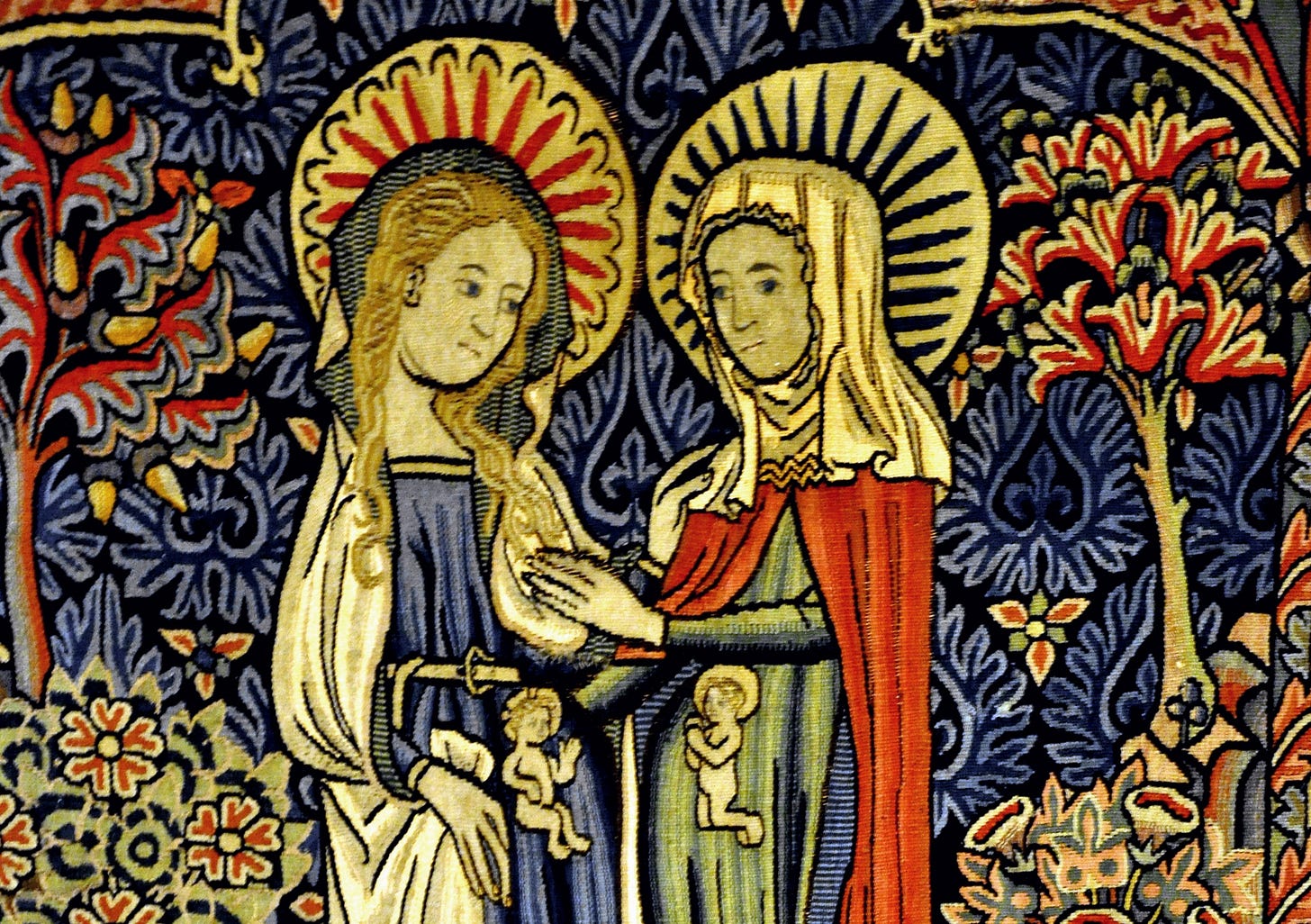 A depiction of the Visitation, with Mary and Elizabeth gazing at each other with tiny depictions of Jesus and John in their wombs.