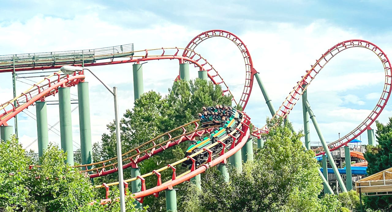 kings dominion anaconda roller coaster in a butterfly turn in front of the loop and sidewinder