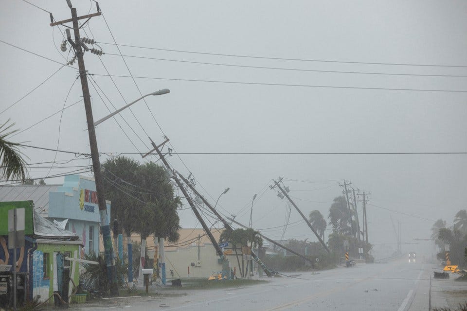 Broken utility poles downed by strong winds