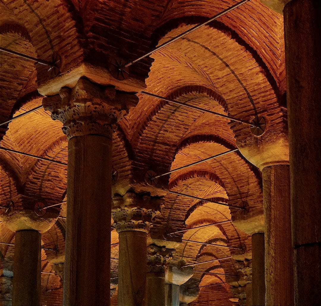 a large room filled with columns and lights