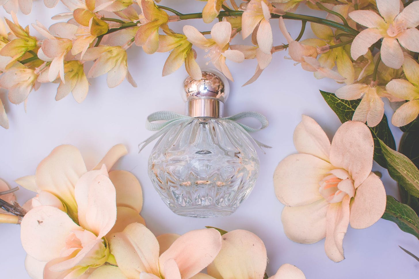 Photo of perfume bottle by Camille Paralisan on Unsplash