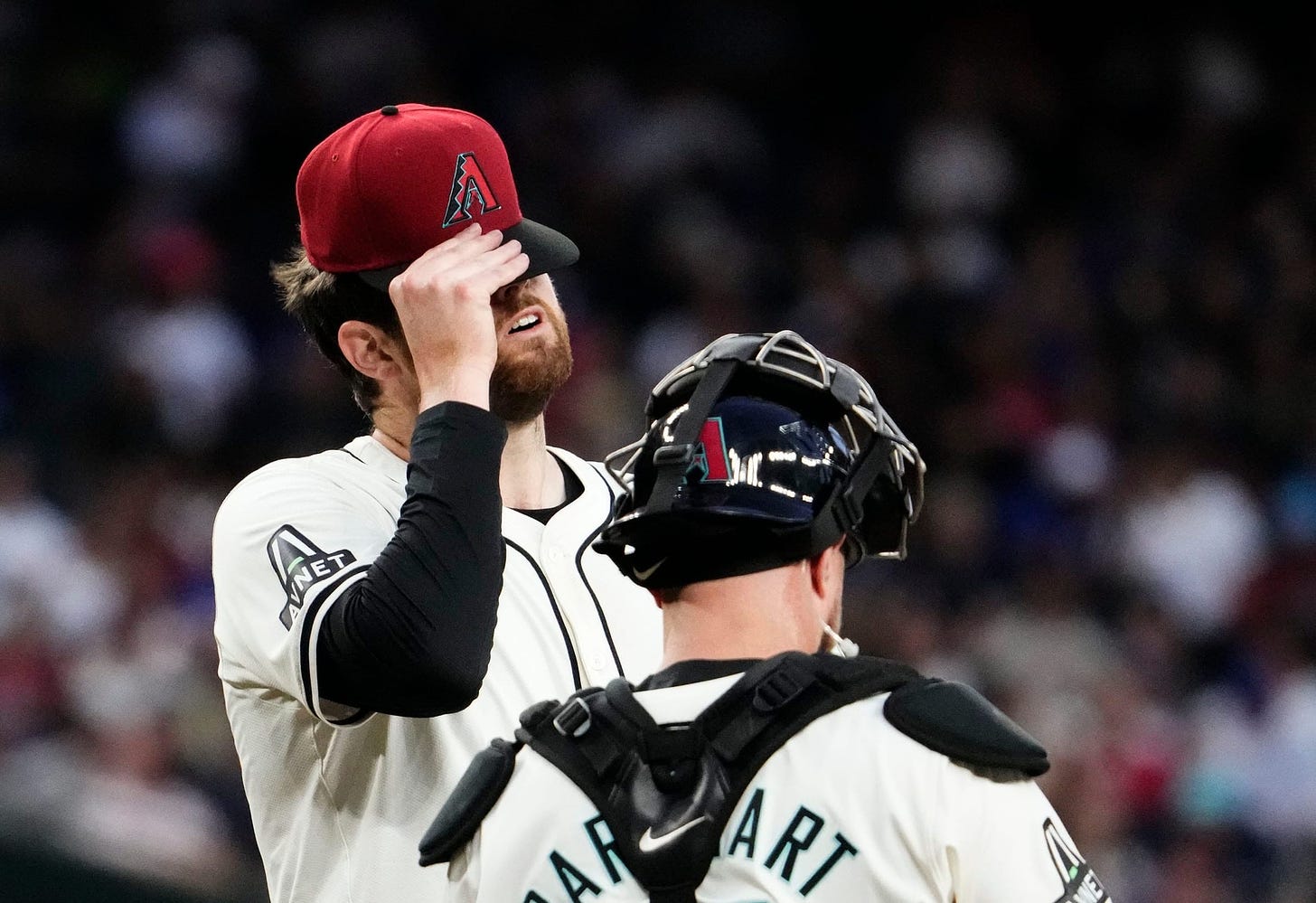 Diamondbacks starting pitcher Jordan Montgomery (52) reacts after Los Angeles Dodgers Austin Barnes (15) hit a two-run RBI-double in the second inning at Chase Field in Phoenix on May 1, 2024.