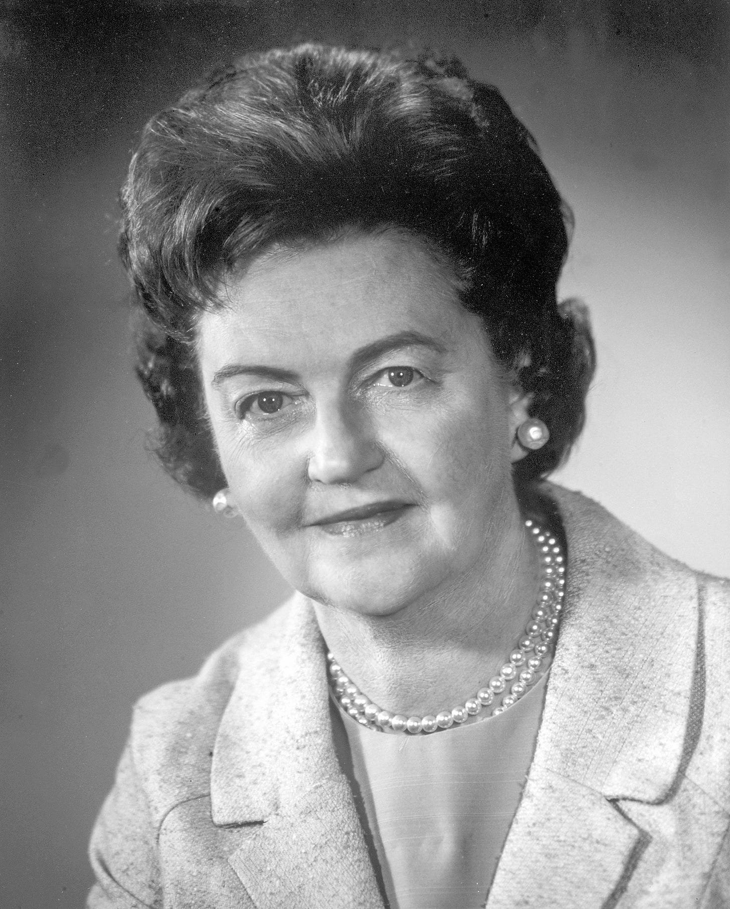 Professional photo of Bernice Eddy in a suit with a pearl necklace