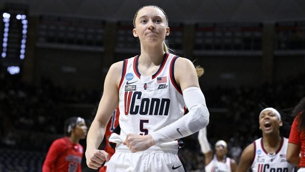 UConn guard Paige Bueckers (5) flexes in the first half of a first-round college basketball game against Jackson State in the NCAA Tournament, Saturday, March 23, 2024, in Storrs, Conn. (AP Photo/Jessica Hill)