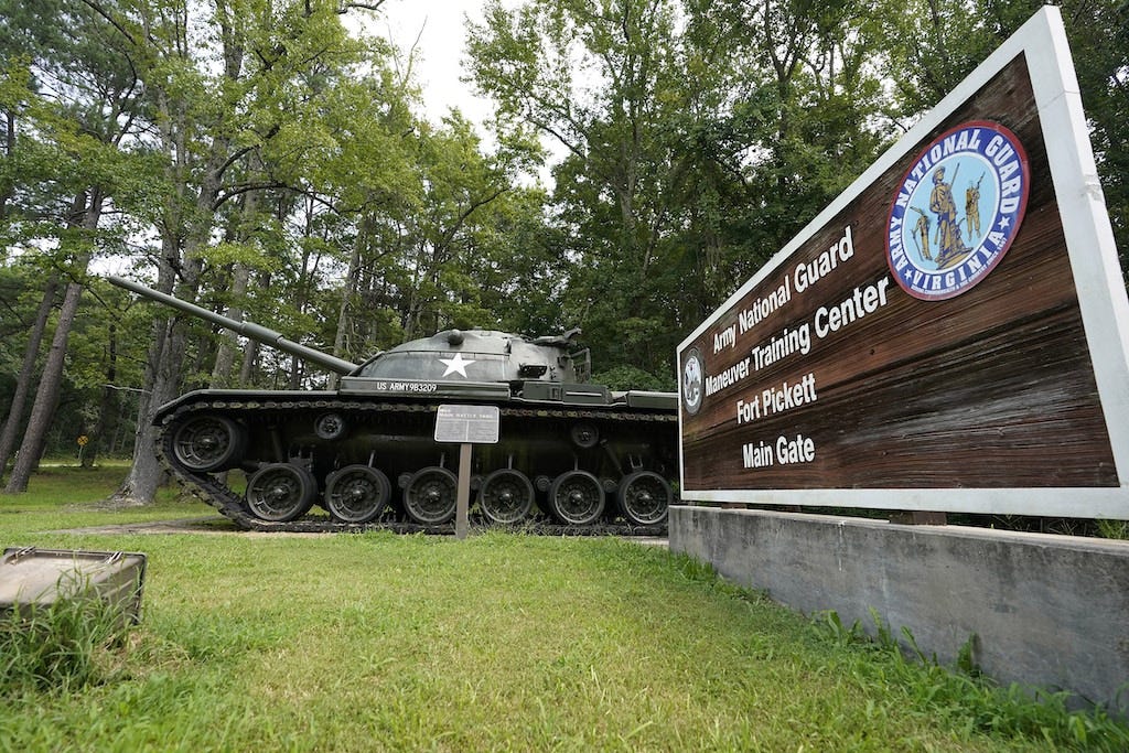 A sign as well as a tank mark the entrance to Fort Pickett Wednesday, Aug. 25, 2021, in Blackstone, Va.