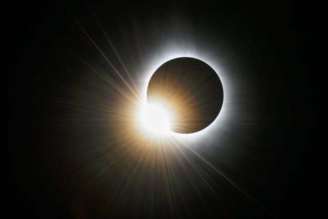 Baily’s beads are seen as sunlight shines through mountains and valleys on the moon during the total solar eclipse as seen from Lancaster, NH, Monday, April 8, 2024.