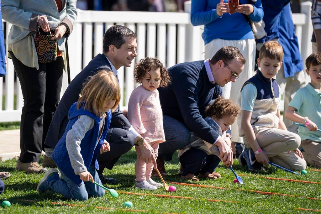 U.S. Secretary of Transportation Pete Buttigieg (L) and husband Chasten Buttigieg and their children Penelope and Gus attend the annual Easter Egg Roll on the South Lawn of the White House in Washington, DC, on April 10, 2023. The tradition dates back to 1878, when President Rutherford B. Hayes invited children to the White House for Easter and egg rolling on the lawn.