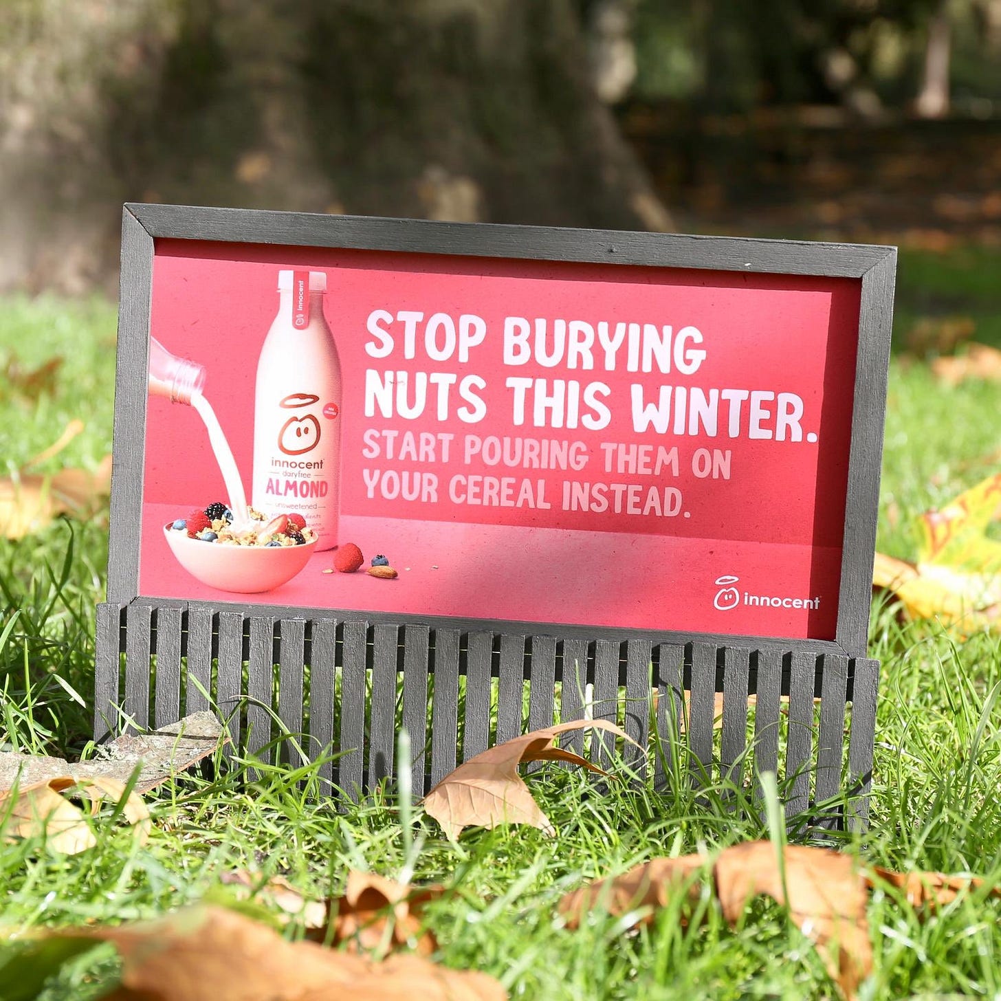 Innocent drinks sign: Stop burying nuts this winter. Start pouring them on your cereal instead