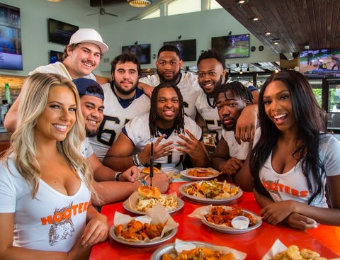 Hooters Signs Offensive Linemen – The Unsung Heroes of College Football –  to NIL Deals Across the Country