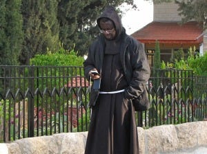 A monk texting (photo courtesy of Simple Folower of Jesus)