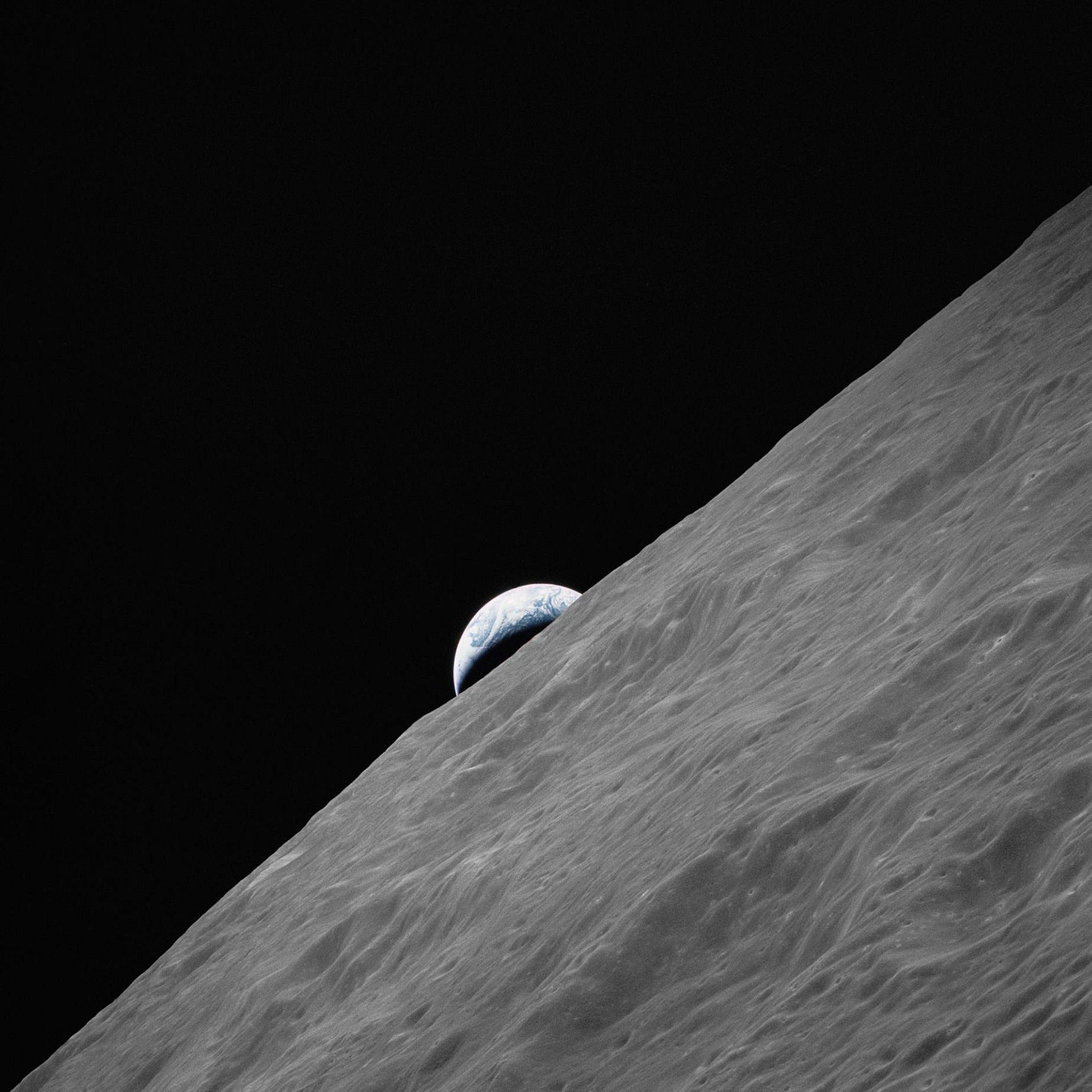AS17-152-23272 (7-19 Dec. 1972) --- The crescent Earth rises above the lunar horizon in this photograph taken from the Apollo 17 spacecraft in lunar orbit during National Aeronautics and Space Administration's (NASA) final lunar landing mission in the Apollo program. While astronauts Eugene A. Cernan, commander, and Harrison H. Schmitt, lunar module pilot, descended in the Lunar Module (LM) "Challenger" to explore the Taurus-Littrow region of the moon, astronaut Ronald E. Evans, command module pilot, remained with the Command and Service Modules (CSM) "America" in lunar orbit. AS17-152-23272 (7-19 Dec. 1972) --- The crescent Earth rises above the lunar horizon in this photograph taken from the Apollo 17 spacecraft in lunar orbit during National Aeronautics and Space Administration's (NASA) final lunar landing mission in the Apollo program. While astronauts Eugene A. Cernan, commander, and Harrison H. Schmitt, lunar module pilot, descended in the Lunar Module (LM) "Challenger" to explore the Taurus-Littrow region of the moon, astronaut Ronald E. Evans, command module pilot, remained with the Command and Service Modules (CSM) "America" in lunar orbit.