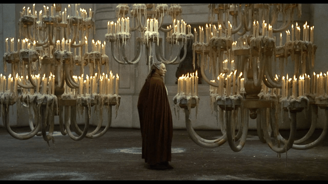 Donald Sutherland as the titular Casanova standing in a room of candelabras in Fellini's 1976 film.