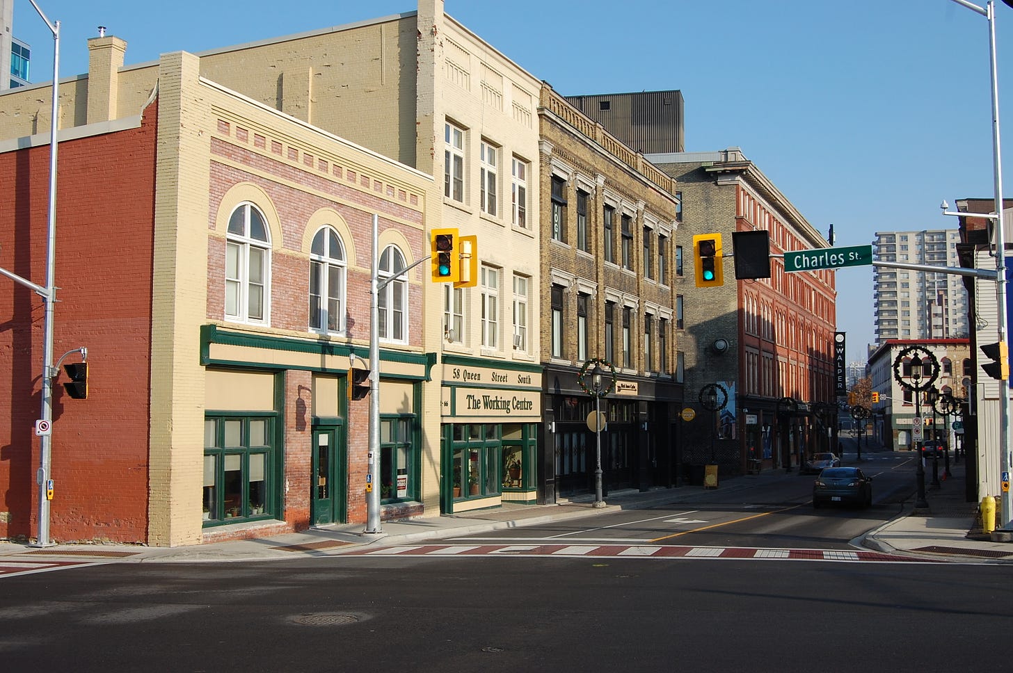 Block of buildings in downtown Kitchener with businesses, organizations, and housing represented.