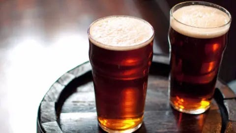  Adermark Media/Getty Images Creative Two pints of beer