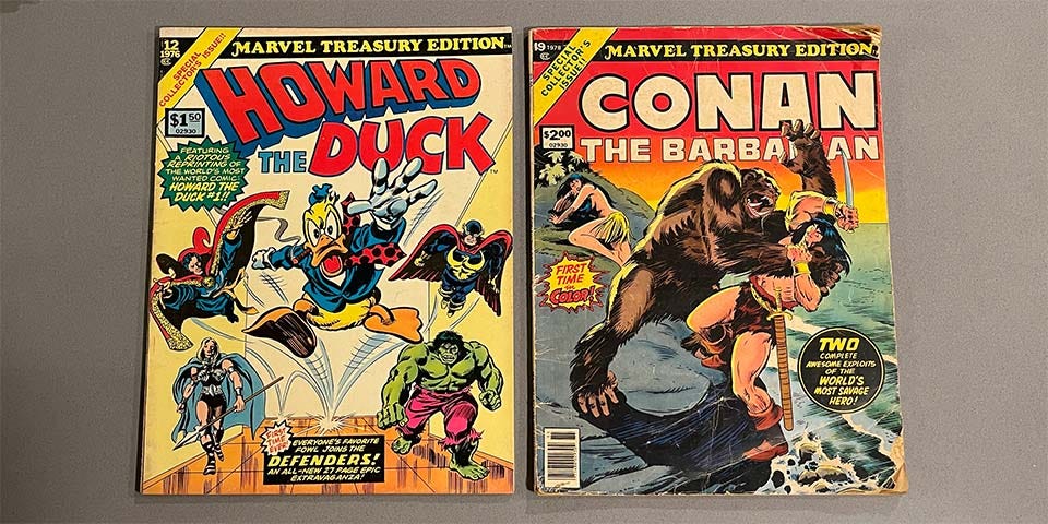 Two Marvel treasury books - Howard the Duck and Conan