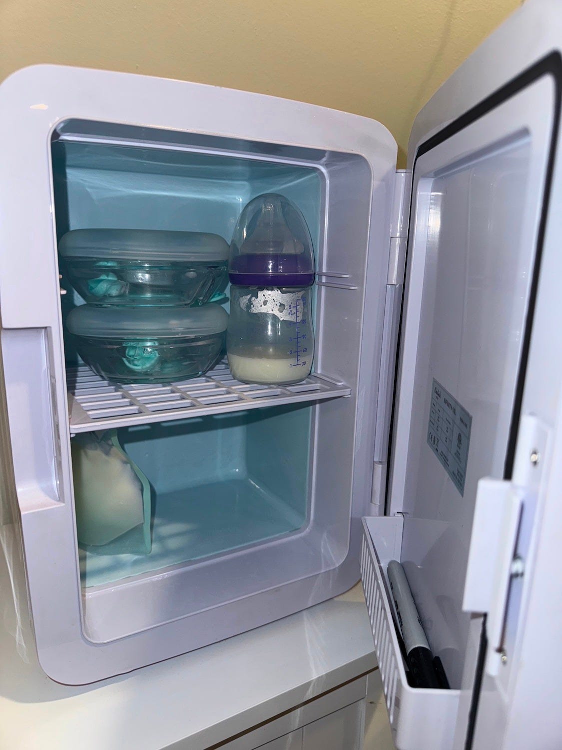 Breast milk inside a repurposed skin care fridge