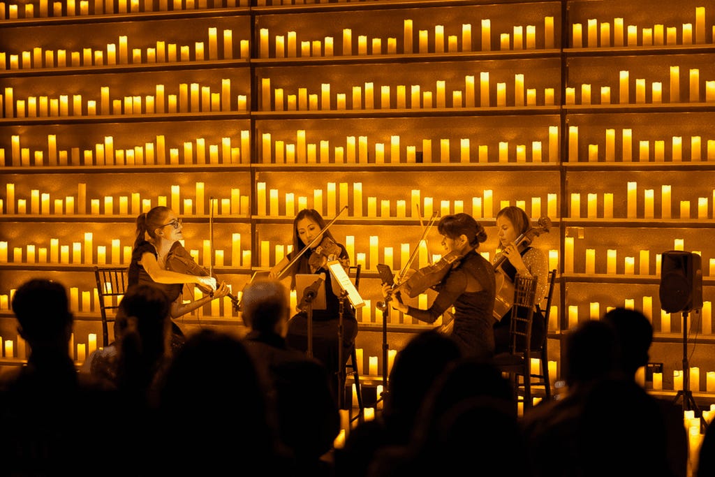 A sting quartet performing by candlelight