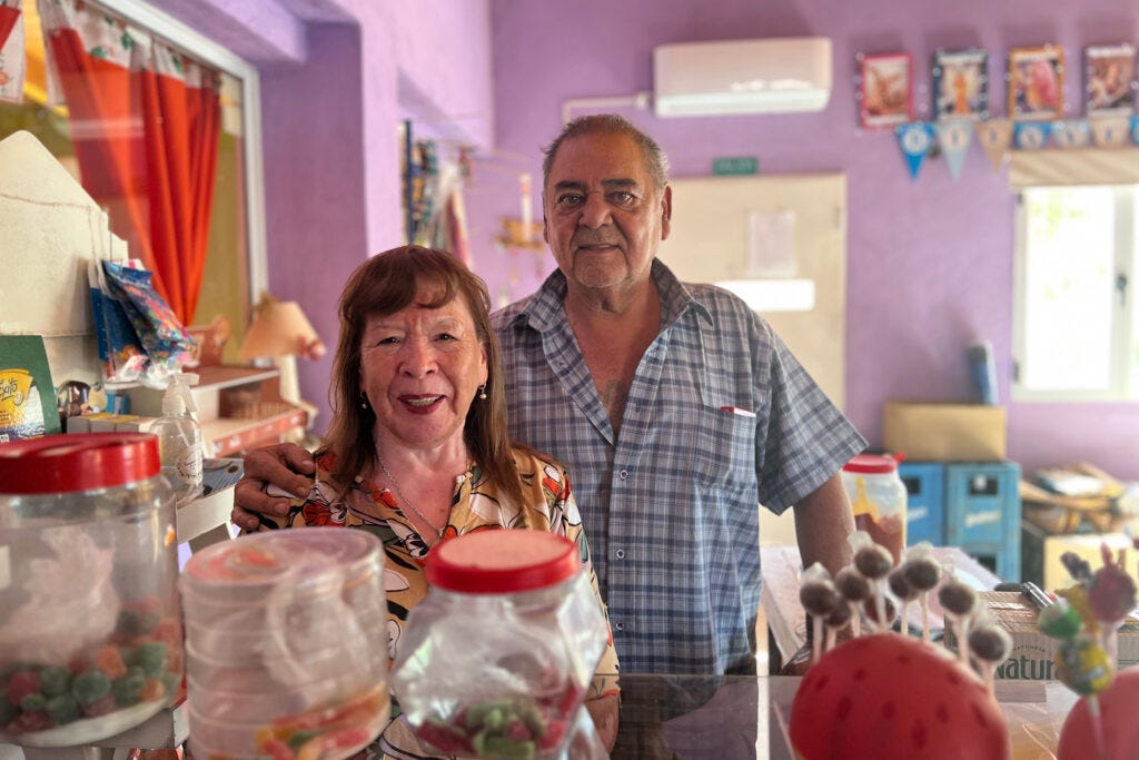 Noemi and Carlos Painevil stand inside the small grocery store that is attached to their Sauzal Bonito home. Credit: Katie Surma/Inside Climate News